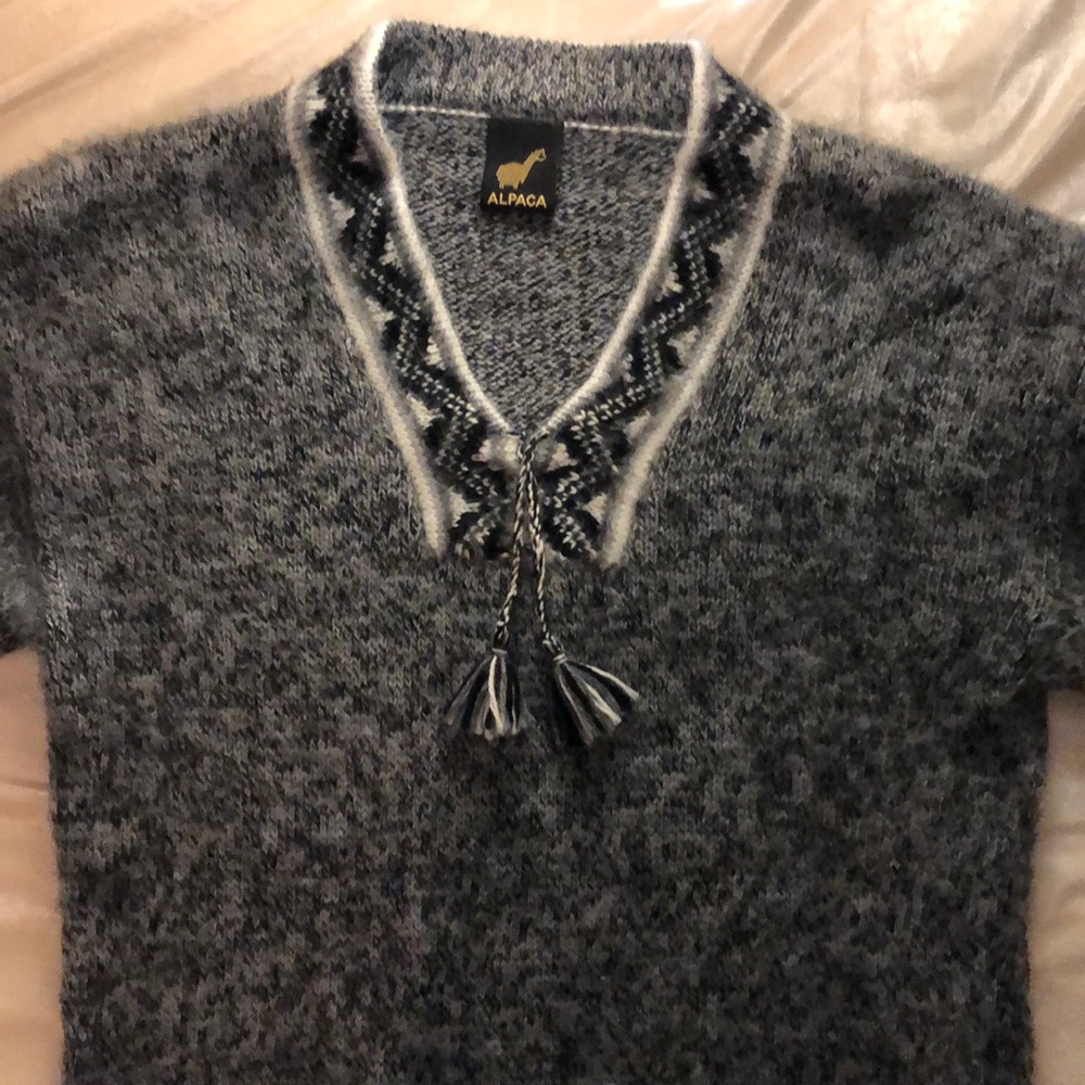 Soft Alpaca wool sweater with fringe at the ends,